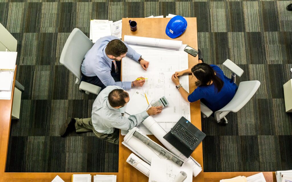 Aerial view of business meeting at desk in library