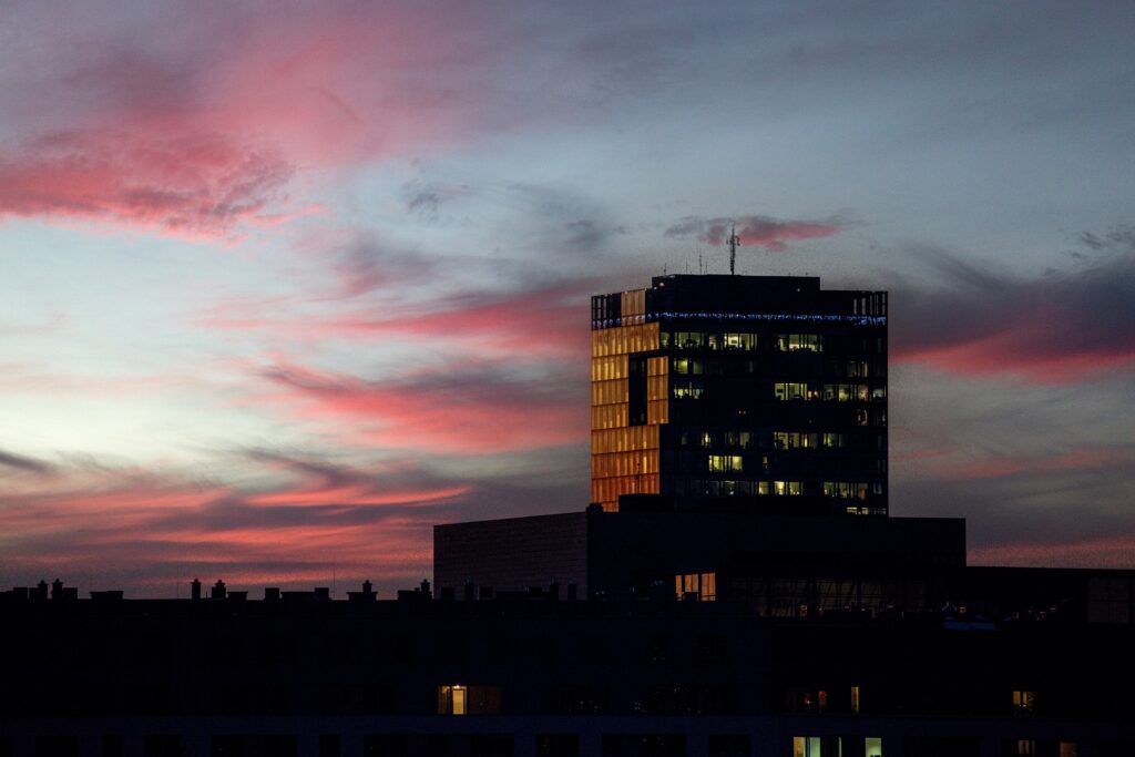 Office building skyline at dusk with dark skies